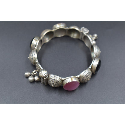 A piece of silver look alike stone bangle