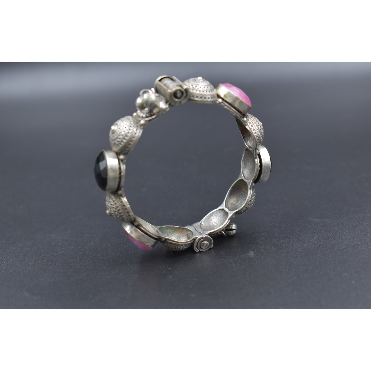 A piece of silver look alike stone bangle