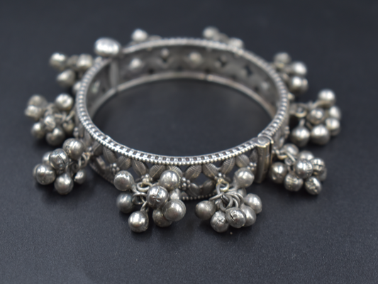 A piece of silver look alike bangle