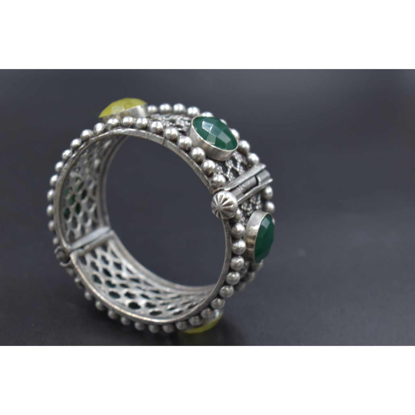 A pair of stone silver look alike bangle