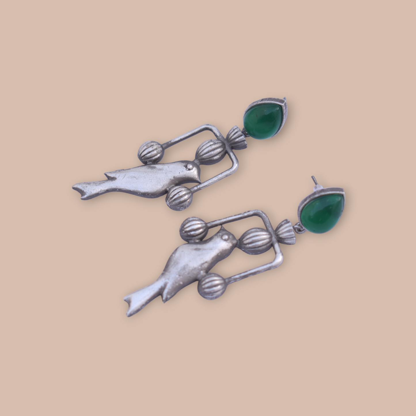A pair of silver look stone bird earing