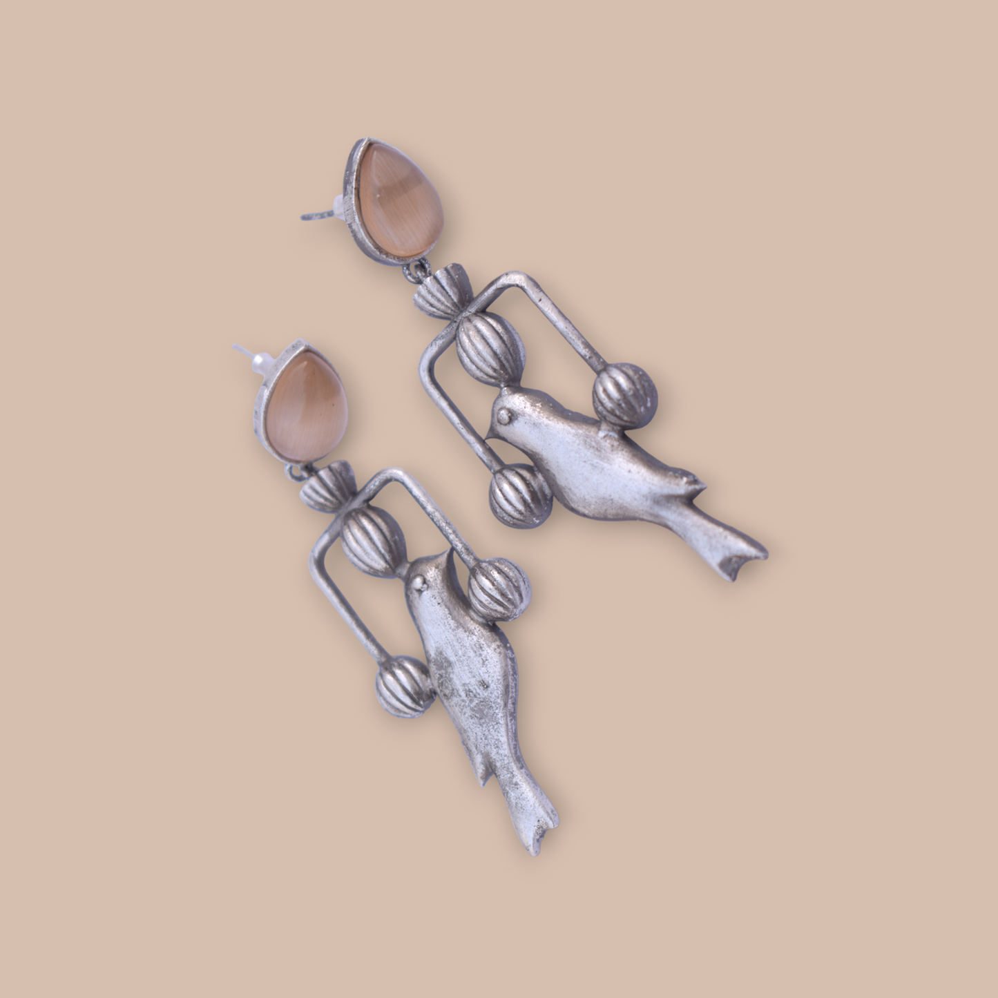 A pair of silver look alike bird earing
